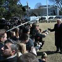 US President Donald Trump speaks to the media as he walks to board Marine One prior to departure from the South Lawn of the White House in Washington, DC, on February 13, 2026. (Photo by ANDREW CABALLERO-REYNOLDS / AFP) US President Donald Trump speaks to the media as he walks to board Marine One prior to departure from the South Lawn of the White House in Washington, DC, on February 13, 2026. (Photo by ANDREW CABALLERO-REYNOLDS / AFP)