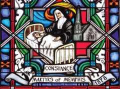 Stained glass window from the Cathedral in Memphis featuring Sister Constance taking care of a sick person