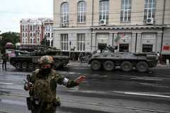 Two Wagner armored vehicles on a street in Rostov-on-Don on Saturday.