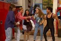 High schoolers doing a hands together and shouting "teamwork!"