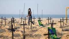 A Rio de Paz member helps create the "monument" on Copacabana