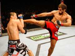 Myrbek Taysumov, right, attacks Korean Top Team's Bang Tae-hyun during the UFC Fight Night 34 lightweight fight in January 2014. Photo = TKO