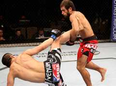 Myrbek Taysumov (right) falls over Korean Top Team's Bang Tae-hyun during the UFC Fight Night 34 lightweight fight in January 2014. Photo = TKO