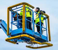 Workers in a bucket lift