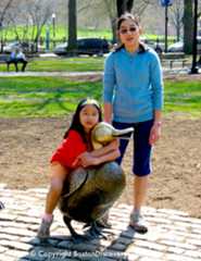 Children posing by Make Way for Ducklings statues in Boston's Public Garden Children posing by Make Way for Ducklings statues in Boston's Public Garden