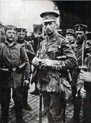 Major C.A.L. Yate, awarded the Victoria Cross for his conduct at the Battle of Le Cateau. Photograph taken of Major Yate with German soldiers, after his capture: Battle of Le Cateau on 26th August 1914 in the First World War