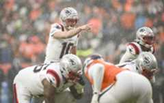 DENVER BRONCOS VS NEW ENGLAND PATRIOTS, NFL DENVER , CO - JANUARY 25: Drake Maye (10) of the New England Patriots leads a drive against the Denver Broncos as the snowfall takes effect during the third quarter at Empower Field at Mile High in Denver, Colorado on Sunday, January 25, 2026. (Photo by AAron Ontiveroz/The Denver Post)