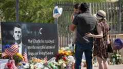 Supporters visit a memorial for Charlie Kirk at the Turning Point Headquarters in Phoenix on Sept. 11, 2025.