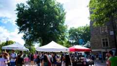 Local food vendors set up tents on campus to offer dishes to students during the weekly Farmer's Market.
