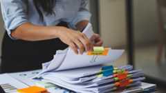 woman sorting through files