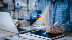 person working on computer with visualization of charts and bars