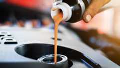 Additive being poured into a car's engine