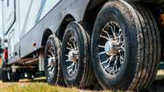 Closeup shot of tires on a fifth-wheel RV trailer.