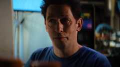 Samuel Sterns wearing a blue t-shirt