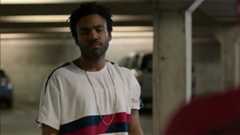 The Prowler talks with Spider-Man in a car park