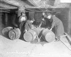 Prohibition agents destroying barrels of alcohol