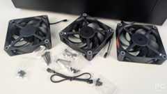 A set of three 120mm HAVN fans set out on the table with bags of various screws and a 4 fan extension lead.