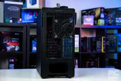 The back of the HAVN BF 360 Flowat an angle. It stands of a white table with a background of PC component boxes on a bookshelf.