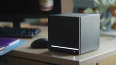 Steam Machine on desk with a mouse, keyboard, and monitor