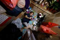 Coco Au lies in her “coffin” home in Hong Kong, China, July 10, 2024. REUTERS/Tyrone Siu