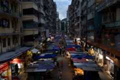 A view of residential buildings in Mong Kok, where many “coffin” homes are located due to convenient transportation, in Hong Kong, China, July 22, 2024. REUTERS/Tyrone Siu