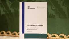 A copy of the newly published joint framework report addressing the legacy of the Northern Ireland Troubles on display A copy of the newly published joint framework report addressing the legacy of the Northern Ireland Troubles on display