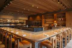 sut-l-dine-lilo-interior-horiz The dining room and kitchen at Lilo restaurant in Carlsbad features a 16-seat dining counter and two four-seat tables. (Kimberly Motos)