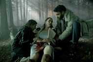 Martha “Em” Cypress (Romy Weltman) and Ibrahim Ramin (Andy McQueen) aid a bleeding Dana Cypress (Melanie Scrofano) in the woods in Revival Episode 105.