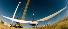 Fitting blades onto a wind turbine
