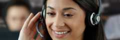 services-photography-website-call-center.jpg Woman answering the phone with a headset