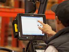 Paper Manufacturer Success Story Person tapping touch screen computer