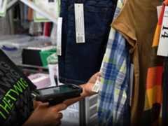 The Twig Success Story Photo, 4x3, 3600 Store worker scanning clothing with Zebra scanner