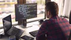 1020187160 Software developer working in a modern office