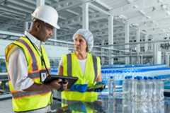 Manufacturing Plant Floor Conveyor Workers Talking Web Photo 1920x1280 Manufacturing Web Photo 3:2