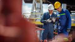 Energy Photography Website Blog Two Workers Looking At Tablet 1280x720